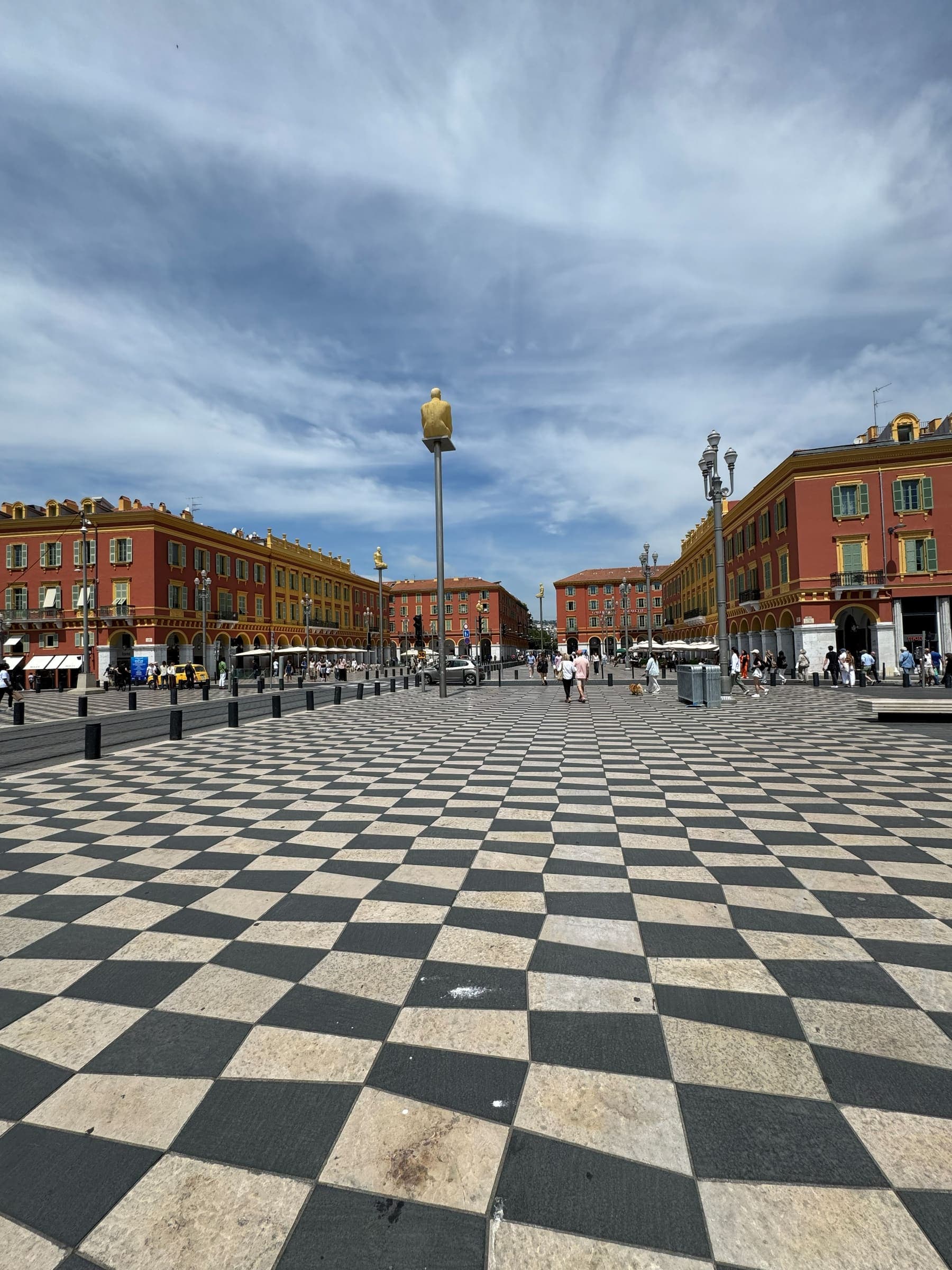 Place Masséna in Nice with its red façades and checkerboard paving